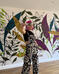 Kathleen with a botanical mural